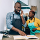 Restaurant owner fielding calls